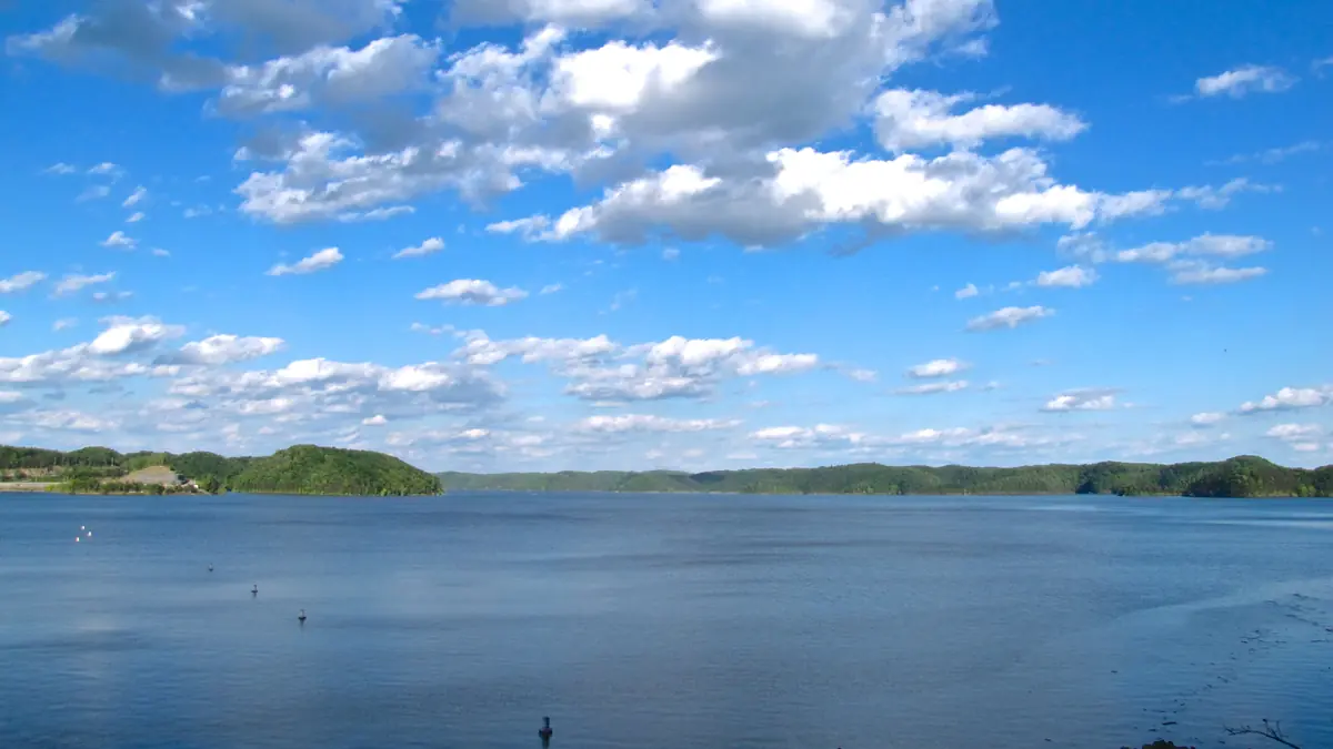 Lake Cumberland just upstream from Wolf Creek Dam under a blue sky with wooded hills on the far shore, Russell County, Kentucky